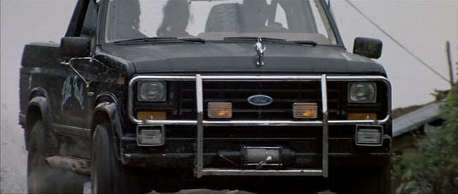 Black Ford Bronco front view, bull bar, winch, aftermarket grille, hood ornament