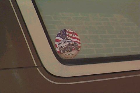 1980 Ford Bronco - A sticker on a vehicle window depicts an off-road truck with an American flag background.