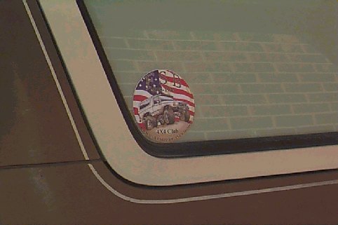 Circular sticker with American flag and a white off-road truck, labeled "4X4 Club"