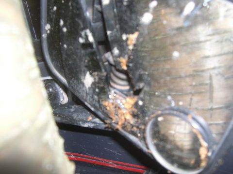 1989 Ford Bronco - Detail of a corroded part, possibly from a vehicle's undercarriage.