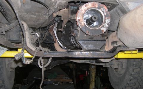 1989 Ford Bronco - Close-up of the vehicle's transmission and driveshaft assembly, likely during a repair or upgrade process.