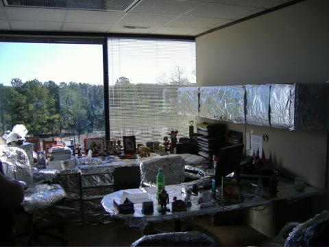 1991 Ford Bronco - An office cubicle is completely covered in aluminum foil, creating a unique and reflective workspace.