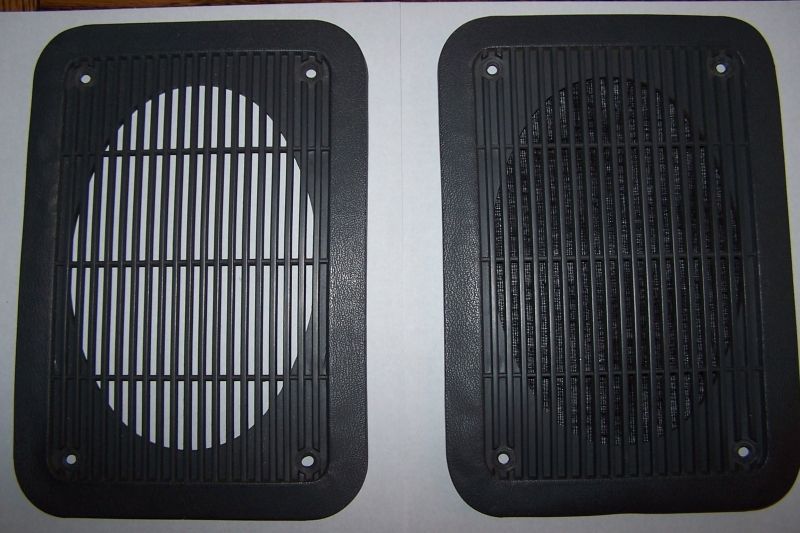 Two dark gray speaker grilles, one with white behind it, the other with a black speaker visible