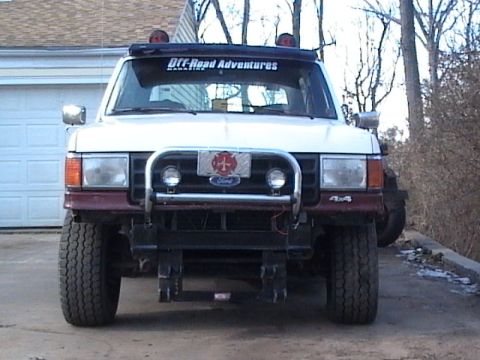1990 Ford Bronco - Bronco with tractor lights and FD plate.