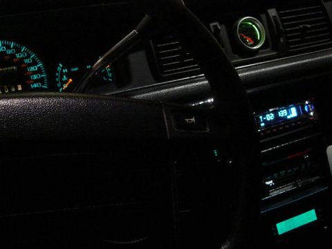 1992 Ford Crown Victoria - Interior view of a 1992 Ford Crown Victoria, illuminated gauges and a digital stereo display.