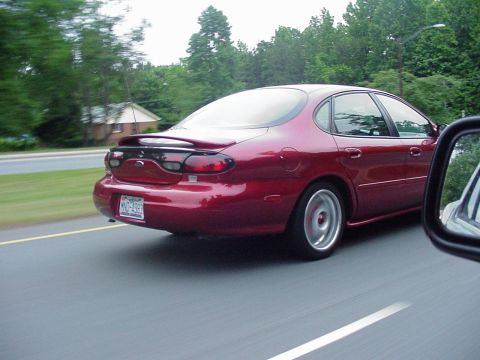 1998 Ford Taurus - This 1998 Ford Taurus is seen from the rear as it drives down a road.