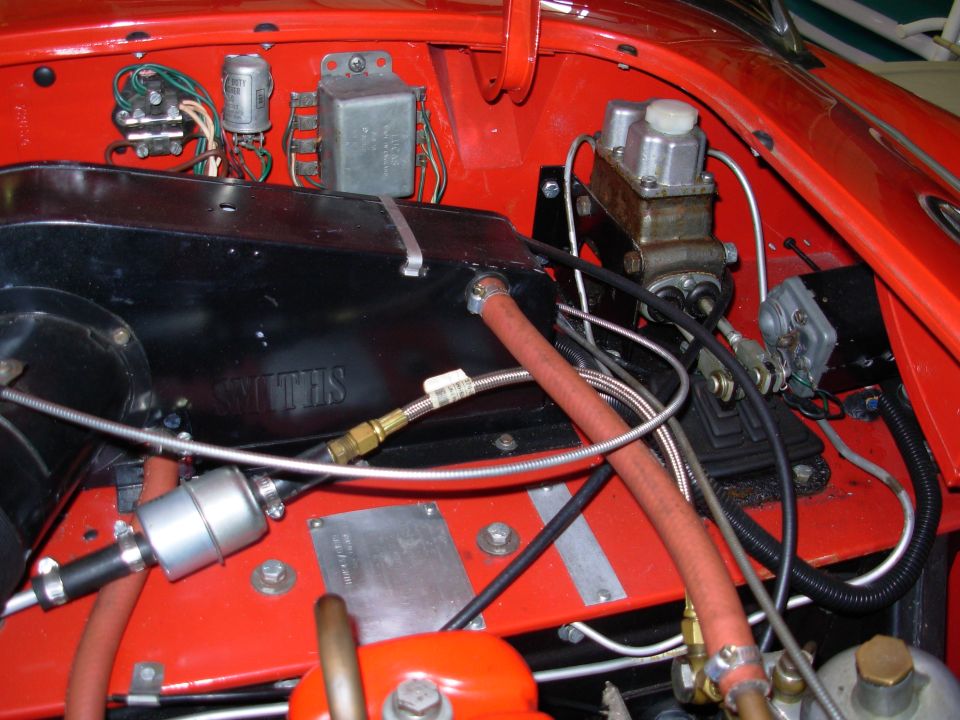 The flash is washing out some of the color. The car is actually very red.