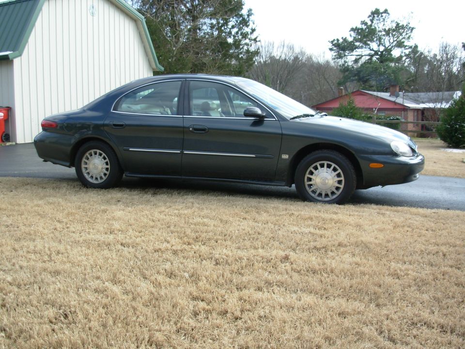 1999 Mercury Sable sedan, side view, dark green