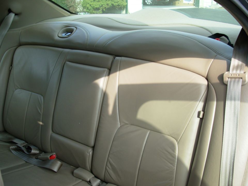 Tan leather rear seats with seatbelts