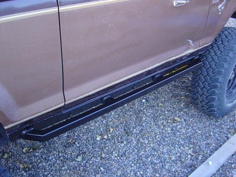 1986 Ford Bronco II - Side profile of a 1986 Ford Bronco II, aftermarket running boards and a tire.