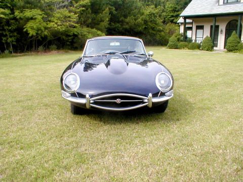 1967 Jaguar XKE - Front view of a 1967 Jaguar XKE coupe on a grassy lawn.