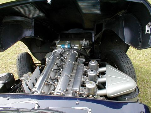 1967 Jaguar XKE - Engine bay of a 1967 Jaguar XKE, showing the inline-six engine and its components.