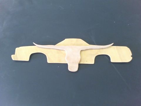 1979 Ford Ranchero - A wooden cutout depicts a pickup truck profile overlaid with a longhorn skull graphic.