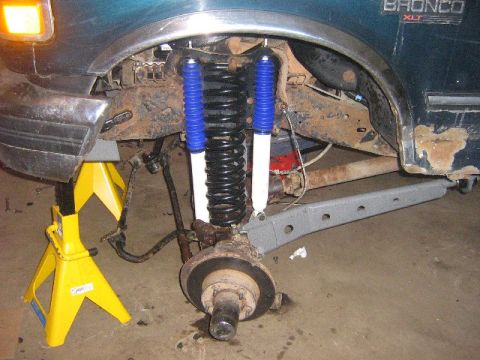 1995 Ford Bronco - Front suspension of a 1995 Ford Bronco XLT, new blue and white shocks and springs.