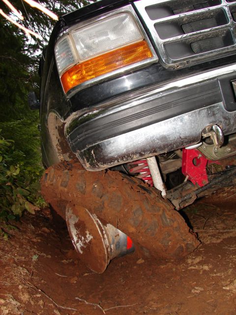 1996 Ford Bronco - This 1996 Ford Bronco is stuck in the mud, with its front passenger wheel deep in the dirt.