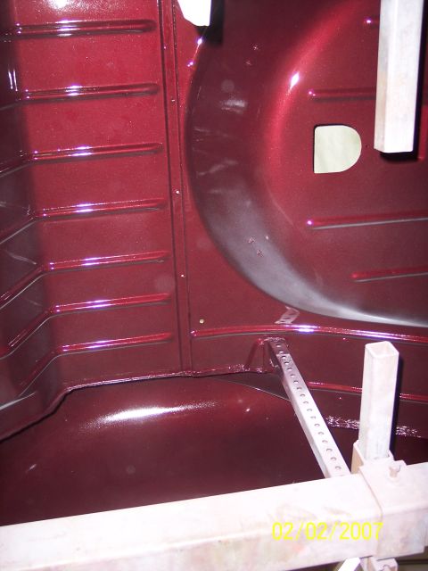 1960 Ford Falcon - The interior of a car shows ribbed panels and a curved wheel well, with a date stamp at the bottom.