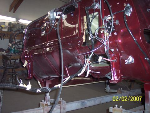 1960 Ford Falcon - The interior of a vehicle undergoing restoration, with exposed wiring and structural components visible.