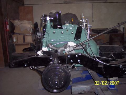 1960 Ford Falcon - Close-up of engine and chassis components, with a date and website visible.