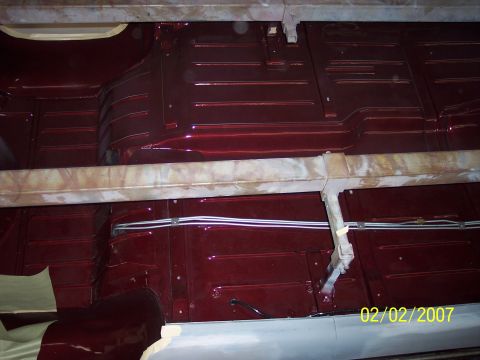 1960 Ford Falcon - Undercarriage of a vehicle, showing painted floor pans and structural supports. Photo dated 02/02/2007.
