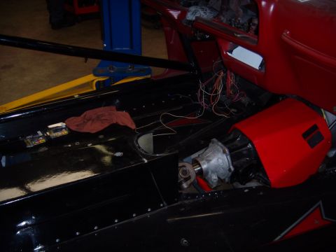 1984 Ford Bronco - Vehicle interior undergoing repairs, showing exposed wiring and transmission components.