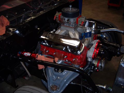 1984 Ford Bronco - Close-up view of a modified V8 engine, highlighting its performance components and custom wiring.