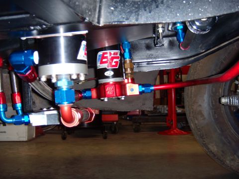 1984 Ford Bronco - Close-up of a BG fuel pump system with braided lines and AN fittings.