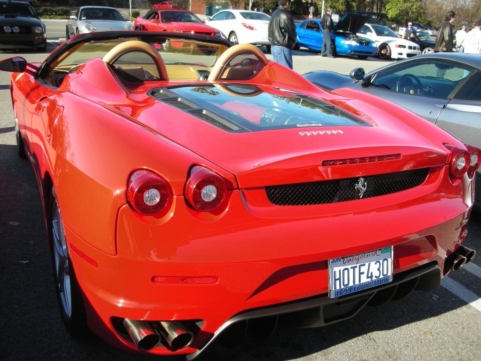 Rear view of a red Ferrari F430 Spider with HOTFL430 plate
