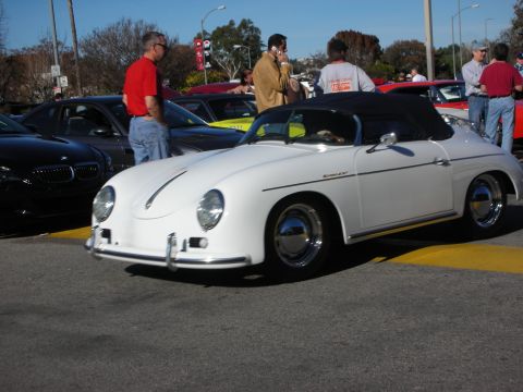 1998 Ford Crown Victoria - white Porsche 356 Speedster-style roadster with chrome bumpers parked among onlookers at a car show.