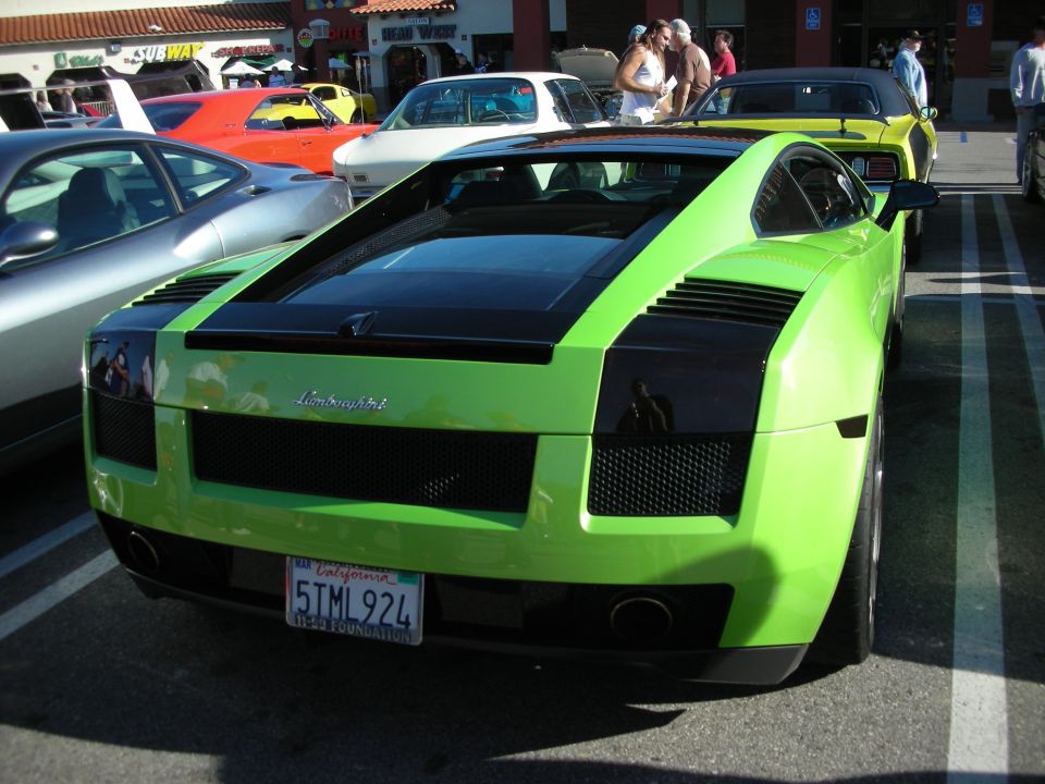 Rear view of a green Lamborghini Gallardo with California plate 5TML924