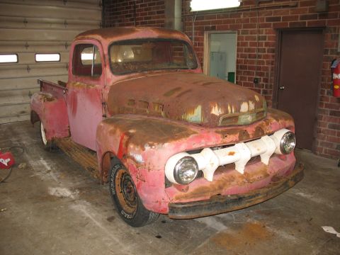 1952 Ford Pickup - This heavily rusted 1952 Ford Pickup is parked indoors, awaiting restoration.