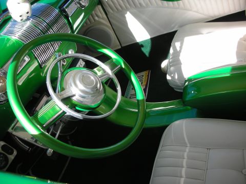 1998 Ford Crown Victoria - Custom interior featuring a green banjo-style steering wheel, chrome accents and white leather seats.