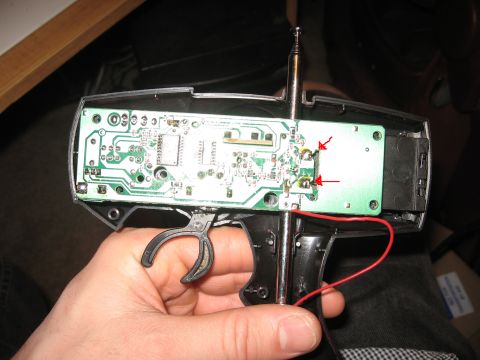 1990 Ford Bronco - Close-up of a remote control's internal circuit board, showing electronic components and wiring.
