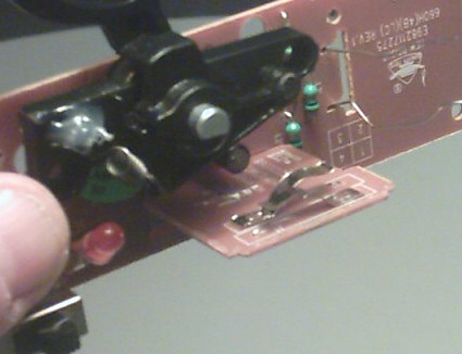 1990 Ford Bronco - A close-up view of a circuit board with various electronic components and a SuperMotors watermark visible.