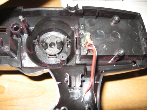 1990 Ford Bronco - Internal components of a remote control car's steering mechanism, showing wiring and gears.