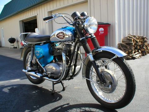 1968 BSA Lightning - A blue 1968 BSA Lightning motorcycle is shown from a three-quarter front view, parked on asphalt.