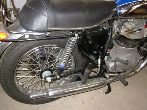 1968 BSA Lightning - Motorcycle rear side view with visible engine and exhaust components. The year 1968 is suggested by the overall design.