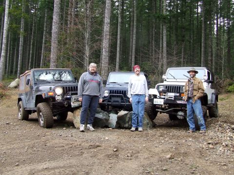 1991 Jeep Wrangler - Three men pose with their Jeep Wranglers in a wooded area.