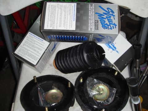 1993 Ford Taurus - New suspension parts are laid out with their packaging and instructions.
