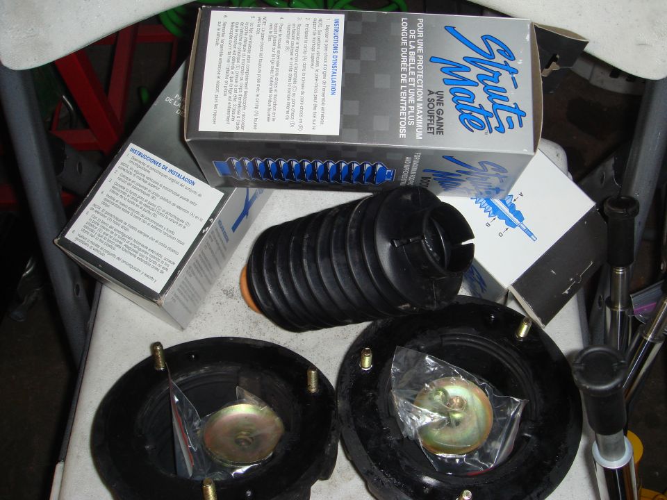 Strut Mate suspension parts including dust boots and mount assemblies, with installation instructions