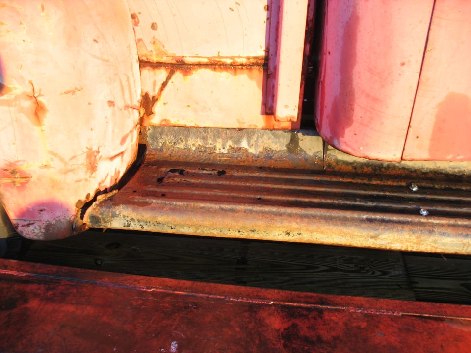 1952 Ford Pickup side step and lower door panel showing rust and wear