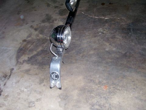 1991 Ford Bronco - KC auxiliary light with chrome bezel and mounting bracket is shown.