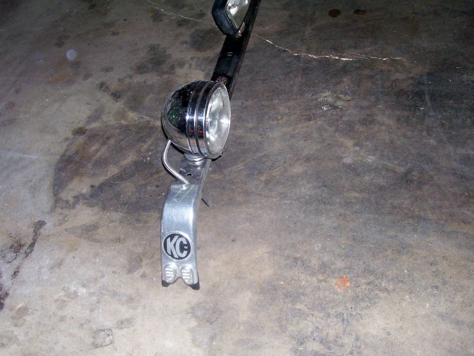 KC auxiliary light with chrome bezel and mounting bracket