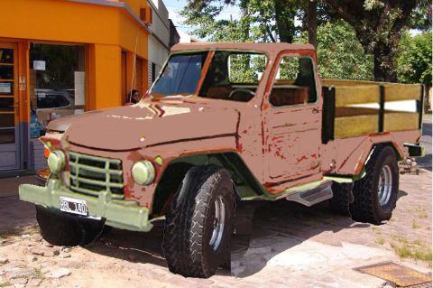 1986 Ford Bronco - This vintage pickup truck has a distinctive front grille and wooden bed, but its exact model year is not identifiable from the image.