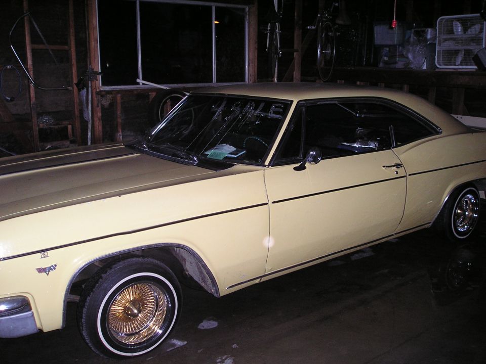 1965 Chevrolet Impala coupe with wire wheels, "FOR SALE" sign on windshield