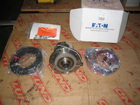 1995 Ford Bronco - New Eaton Performance Differentials parts, including wiring and instructions, are laid out on a cardboard surface.