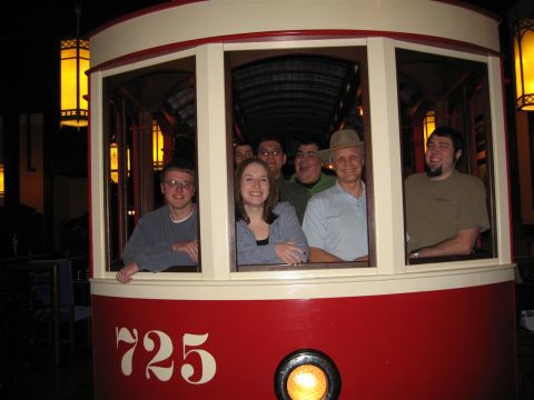 1994 Ford Probe - A group of people are visible inside a vintage streetcar, with the number 725 displayed on its side.