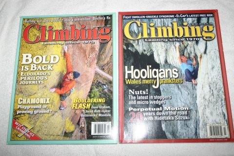 2003 Jeep TJ - Two issues of Climbing magazine are displayed, climbers on rock faces and in caves.