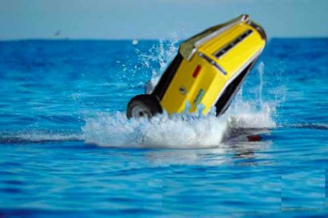 1971 Ford Ranchero - Vehicle partially submerged in water, creating a splash.