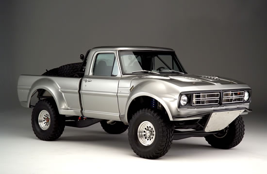 Silver 1974 Ford F-100 pickup truck with off-road suspension and large tires