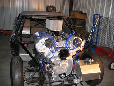 1974 Ford F-100 - Custom drag car engine bay with V8 engine and roll cage visible.